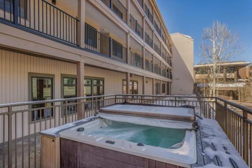 a hot tub on the balcony of a building at New Listing 2BR 2BA Condo - Mountain Views in Aspen