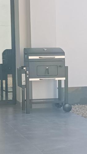 a printer sitting on a stand in a room at Casa Rural La Yesería Alcocer in Sacedón