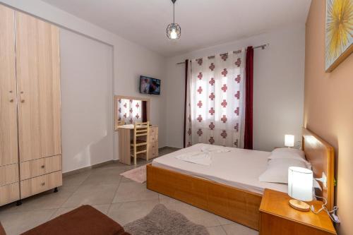 Postel nebo postele na pokoji v ubytování Hotel Shkodra L