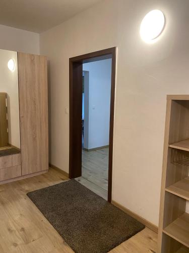 an empty room with an open door and a hallway at Zámecký Dvůr Černousy in V Poli