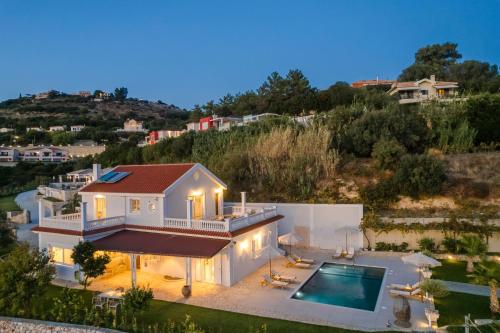 an aerial view of a house with a swimming pool at Pantheon Villa Svoronata in Svoronata