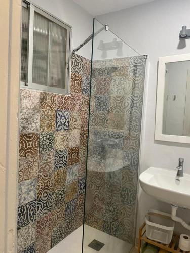 a bathroom with a shower and a sink at Apartamento acogedor El portil in El Portil