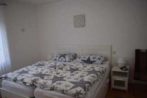 a bedroom with a bed with a quilt on it at Sögel HA01 in Sögel