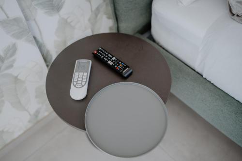a round table with two remote controls on it at DimorAmare in Bari
