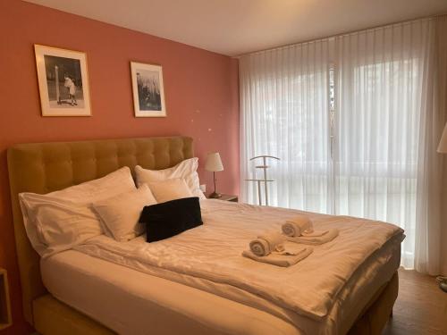 Postel nebo postele na pokoji v ubytování The R Apartment Adlisberg