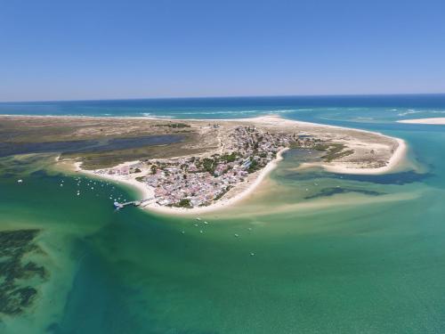 an aerial view of a small island in the ocean at Orbitur Ilha de Armona in Olhão