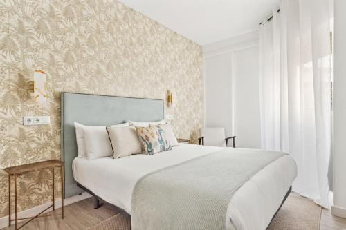 Posteľ alebo postele v izbe v ubytovaní Epidemia & quite bedrooms by ELE Apartments