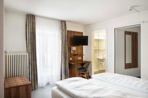 Postel nebo postele na pokoji v ubytování Hotel Resslirytti