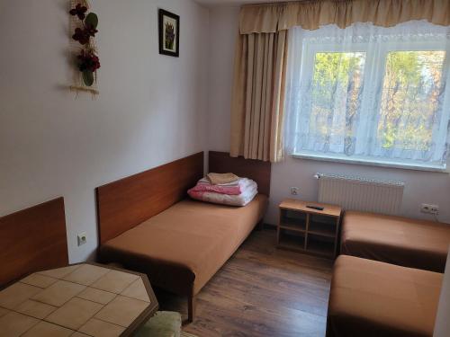 Postel nebo postele na pokoji v ubytování Pensjonat Lissa