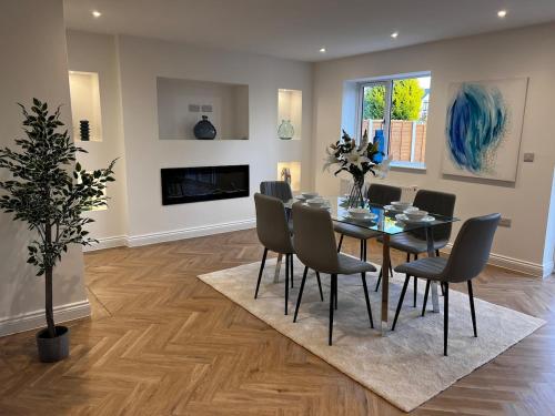 a dining room with a table and chairs at Beautiful, luxury house! in Higham on the Hill