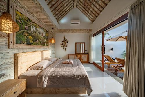 Postel nebo postele na pokoji v ubytování Ketut Losmen Villas Lembongan