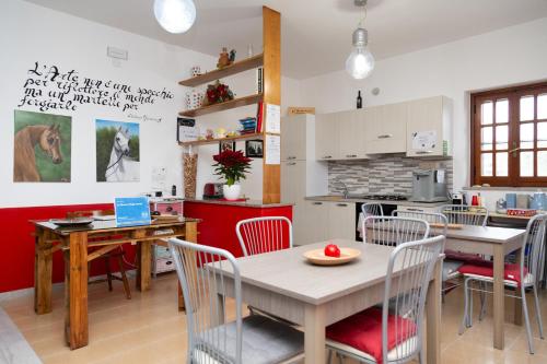 a kitchen and dining room with a table and chairs at La Dimora Degli Artisti in Catanzaro