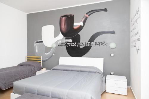 a bedroom with a bed and a sign that reads every guest needs me time at La Dimora Degli Artisti in Catanzaro