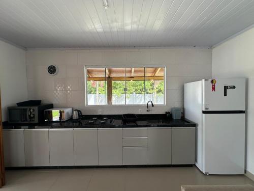 Dapur atau dapur kecil di Casas do Mampituba