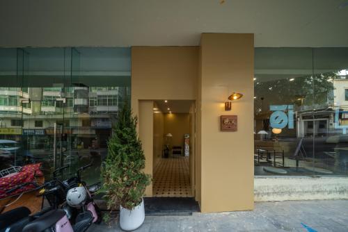 a building with motorcycles parked outside of a building at Xiamen Evening Breeze Hotel in Xiamen