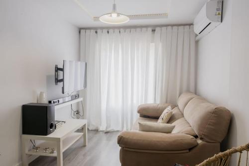 TV a/nebo společenská místnost v ubytování Apartamento cerca del Pilar