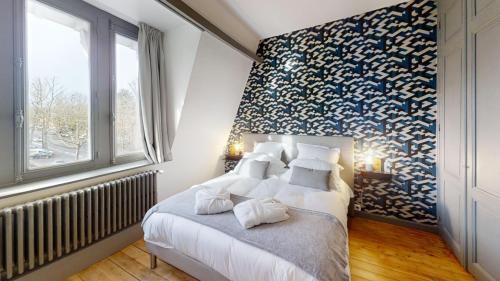 Voodi või voodid majutusasutuse Maison Colodge DELORY BARBIEUX toas