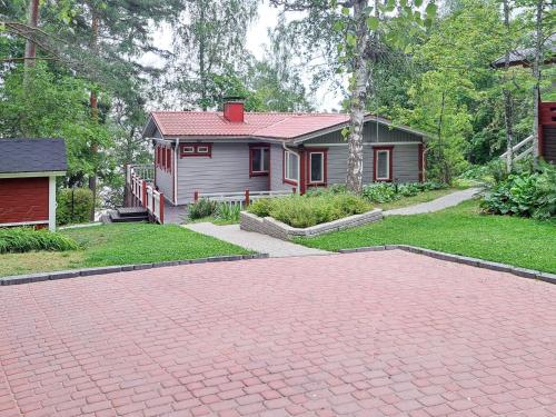 a brick driveway in front of a house at Holiday Home Lomaranta by Interhome in Paksalo