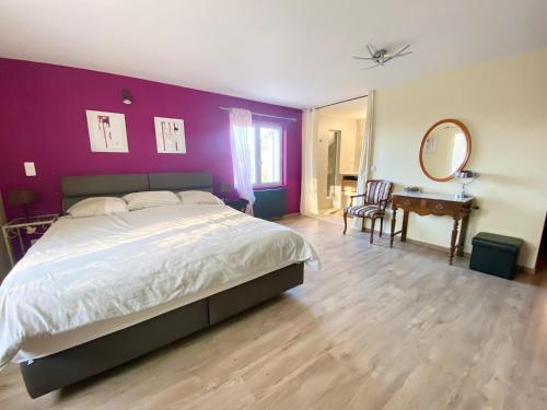 Postel nebo postele na pokoji v ubytování La Villa Dolia