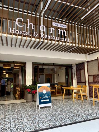 a sign in front of a hospital and restaurant at Charm Hostel at Jomtien in Jomtien Beach