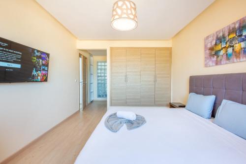 Postel nebo postele na pokoji v ubytování Migdal Gueliz Apart Hôtel