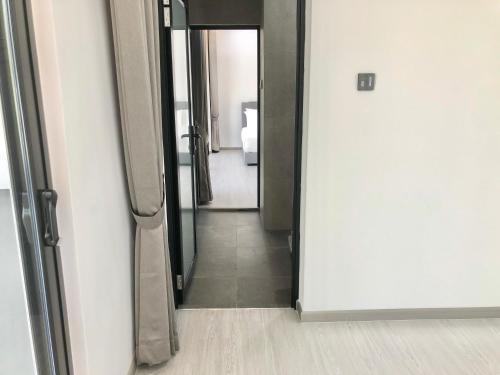 an open door to a hallway with a bathroom at BigLanded House NR Penang Hill & Kek Lok Si Temple in Ayer Itam
