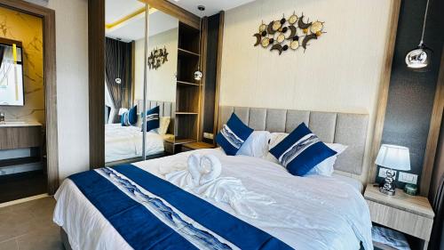 Postel nebo postele na pokoji v ubytování 芭提雅市中心别墅