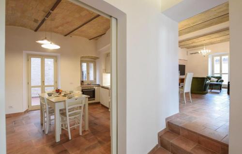 a kitchen and living room with a table and chairs at Stunning Home In Spello With Wifi in Spello