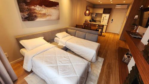 Ένα ή περισσότερα κρεβάτια σε δωμάτιο στο Luxury Flat no Serra Class.