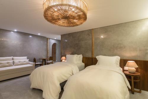 Yemanjá Hotel by Preabeach Experienceにあるベッド