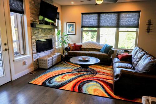 a living room with a couch and a table at Rendezvous - 99 Stagecoach in Fraser