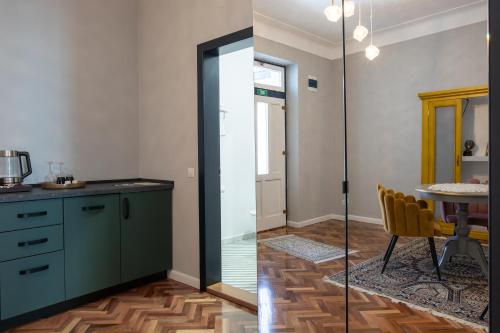 a kitchen with a glass door and a table at MAGISTER seven in Sibiu