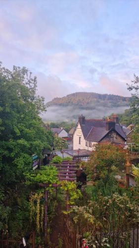 a view of a village with a house and trees at Y Gwydyr Hotel - Dolwyddelan in Dolwyddelan