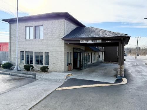 a building with a parking lot in front of it at Days Inn by Wyndham Morristown in Morristown
