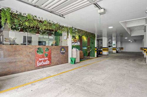 a building with plants on the wall in a hallway at Hotel Eco Suite in Cali