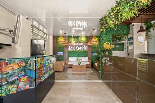 a restaurant with a grocery store with plants at Hotel Eco Suite in Cali