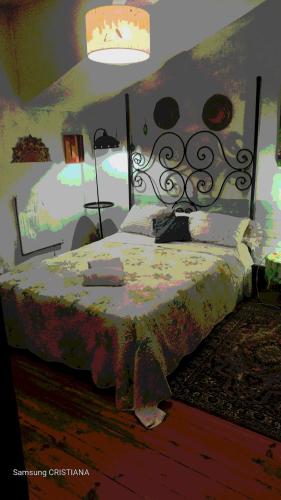 a bedroom with a bed with a floral bedspread at AL- Almada 4 in Porto