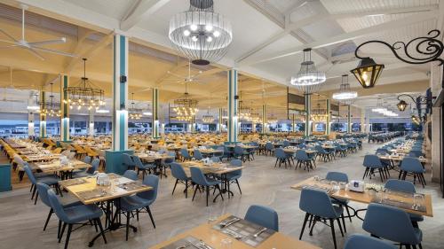a large dining room with tables and chairs at Club Marco Polo - Premium All Inclusive in Kemer