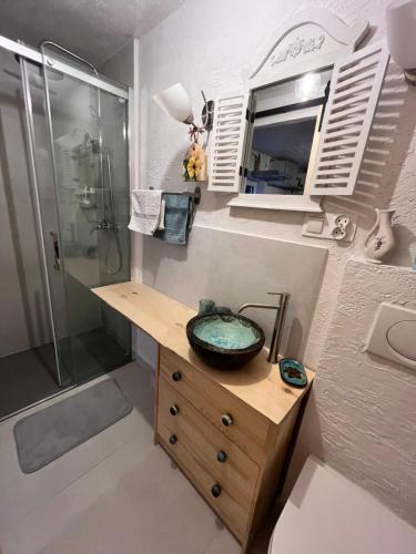 a bathroom with a sink and a shower at Kwatera Na Śliwkowej in Zabrzeg