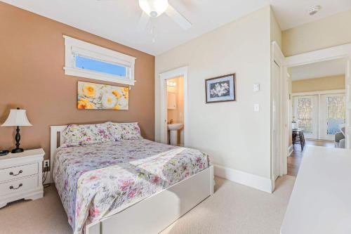 a bedroom with a bed and a dresser and a window at The Lynx - 35 Butternut in Cherry Valley