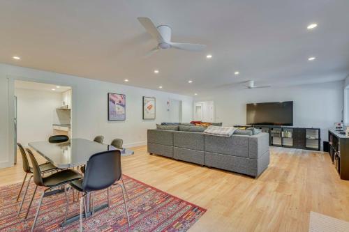 a living room with a couch and a table at Riverfront Hideaway in Keene Walk to Town! in Keene