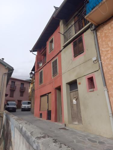 a street with buildings and cars parked on the street at Le Belvedeou - Mercantour in Belvédère