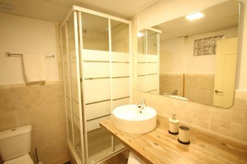 a bathroom with a sink and a mirror at Mansión Alhamar Beachfront in Sitio de Calahonda