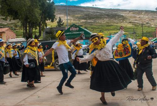 a group of people dancing on a street at Malka Casas - Hoteles in Marco