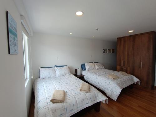 A bed or beds in a room at Edificio Construiblec República