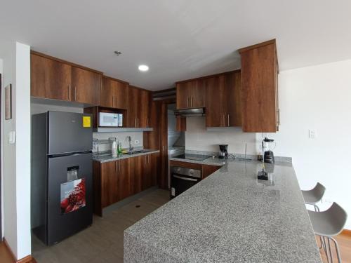 A cozinha ou cozinha compacta de Edificio Construiblec República