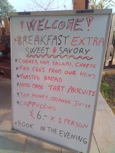 a sign with writing on it on a sidewalk at Podere Kiri Dome Experience in Decimomannu