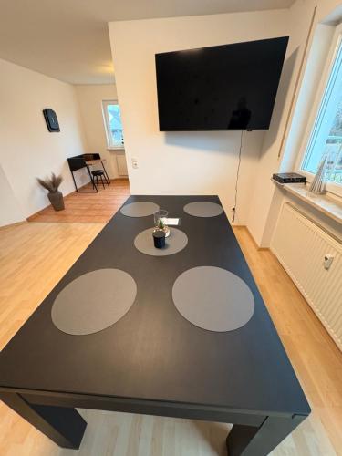 a black table with circles on it in a living room at InSight Luxury Bavarian Retreat in Kemnath