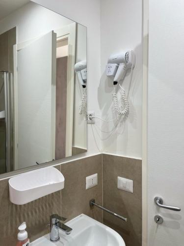 a bathroom with a sink and a mirror at GIULY SUITES & ROOMS in Naples