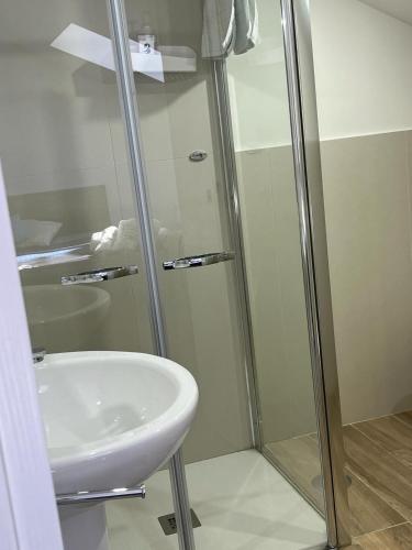 a bathroom with a shower and a sink at GIULY SUITES & ROOMS in Naples